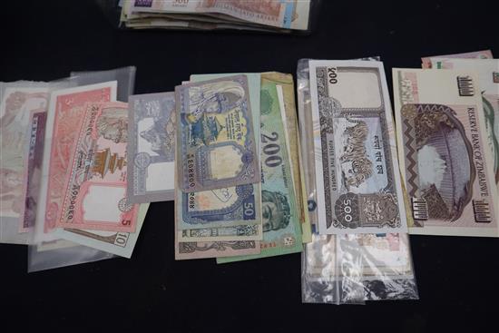 A collection of GB and World coins and banknotes, including some silver proof two pound coins, etc.